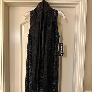 Great for Halloween/Holidays. Never been worn Flapper black/silver dress.